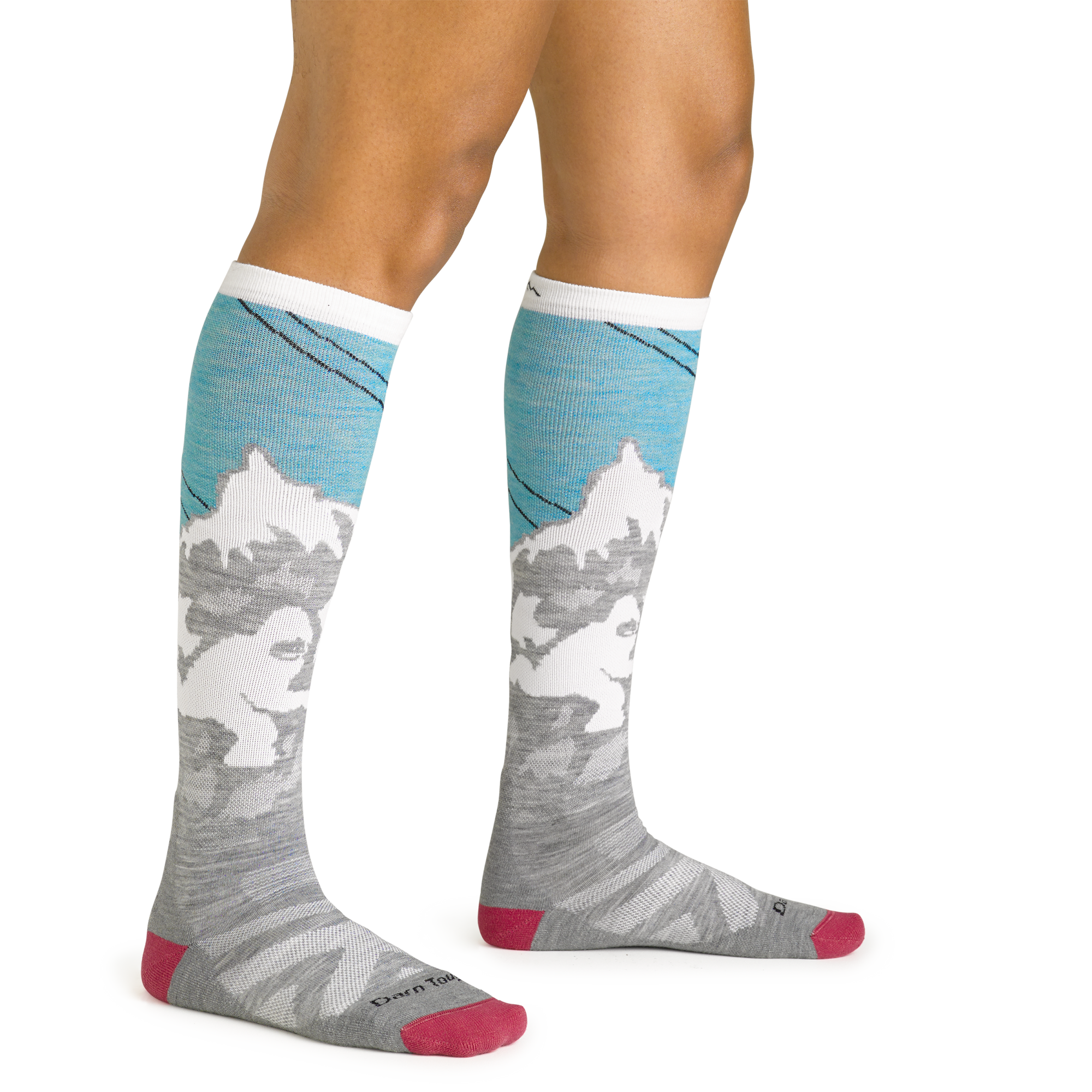 Close up studio shot of model wearing the Darn Tough Yeti over-the-calf ski sock in Aqua