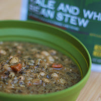 Good To-Go Kale and White Bean Stew camping food in a bowl.