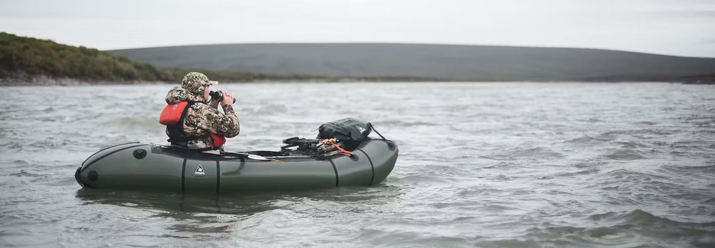 Hunter Scoping on the water with his gear