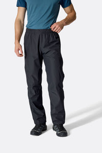 Rab Men's Downpour Waterproof Pants in Black, worn front
