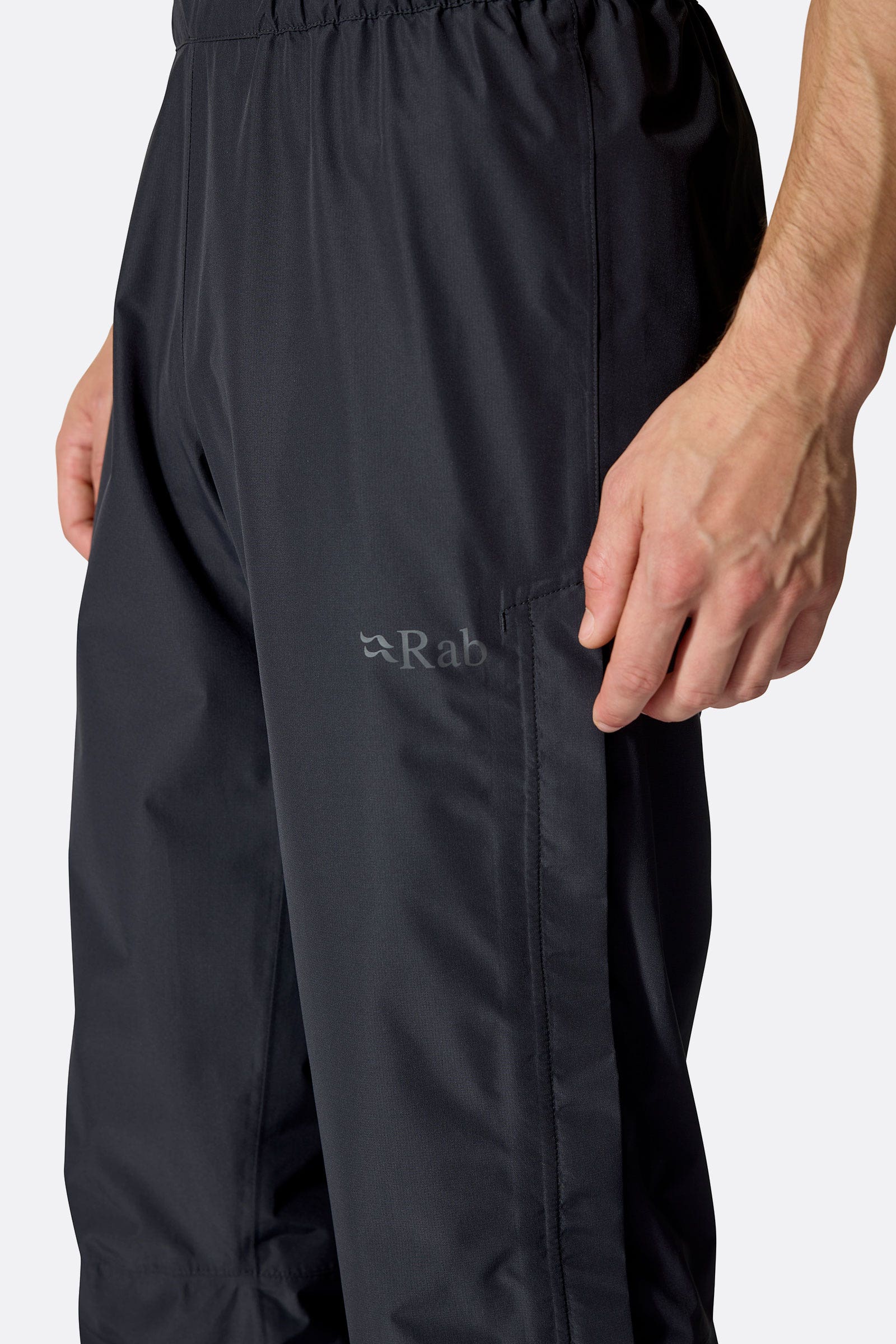 Rab Men's Downpour Waterproof Pants in Black, worn back