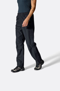 Rab Women's Downpour Waterproof Pants in Black, worn front
